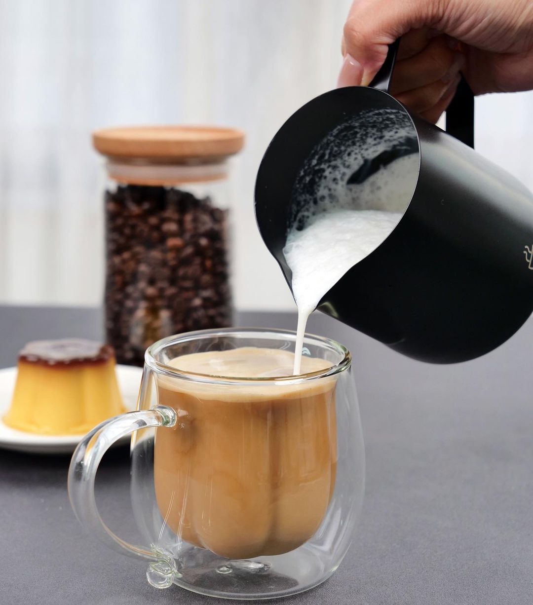 Milk steamer outlet cup